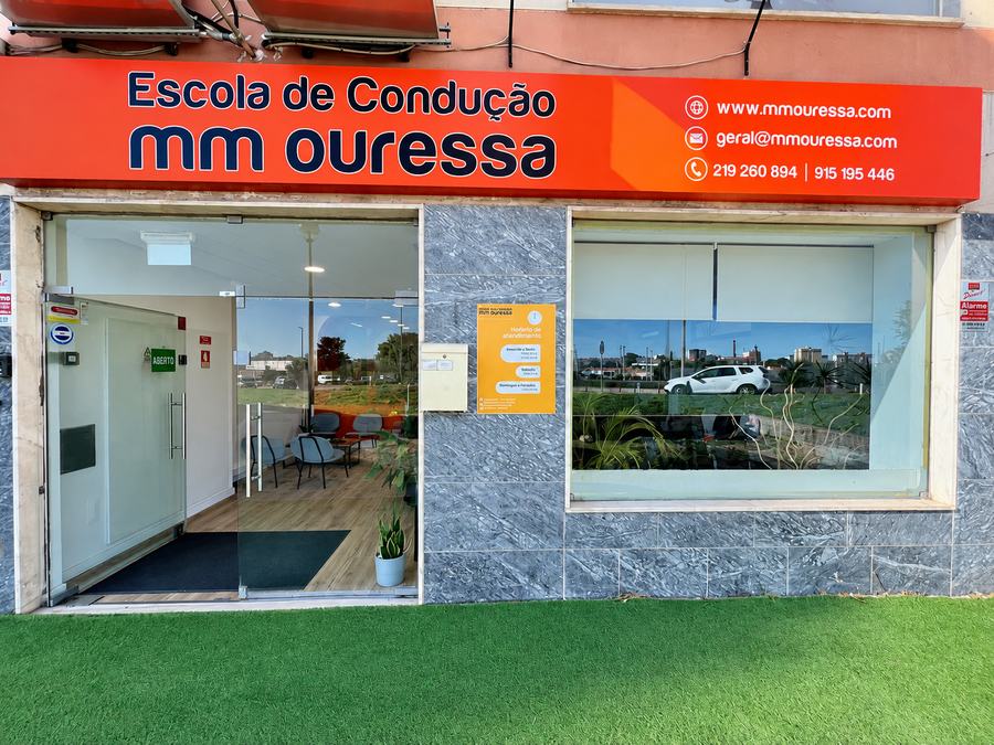 Front of MM Ouressa Driving School in Mem Martins, with the school's orange sign
